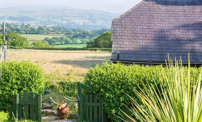 There is a lovely view from the garden.  During summer months there are 2 sun loungers available along with a firepit and a gas BBQ.  The summerhouse